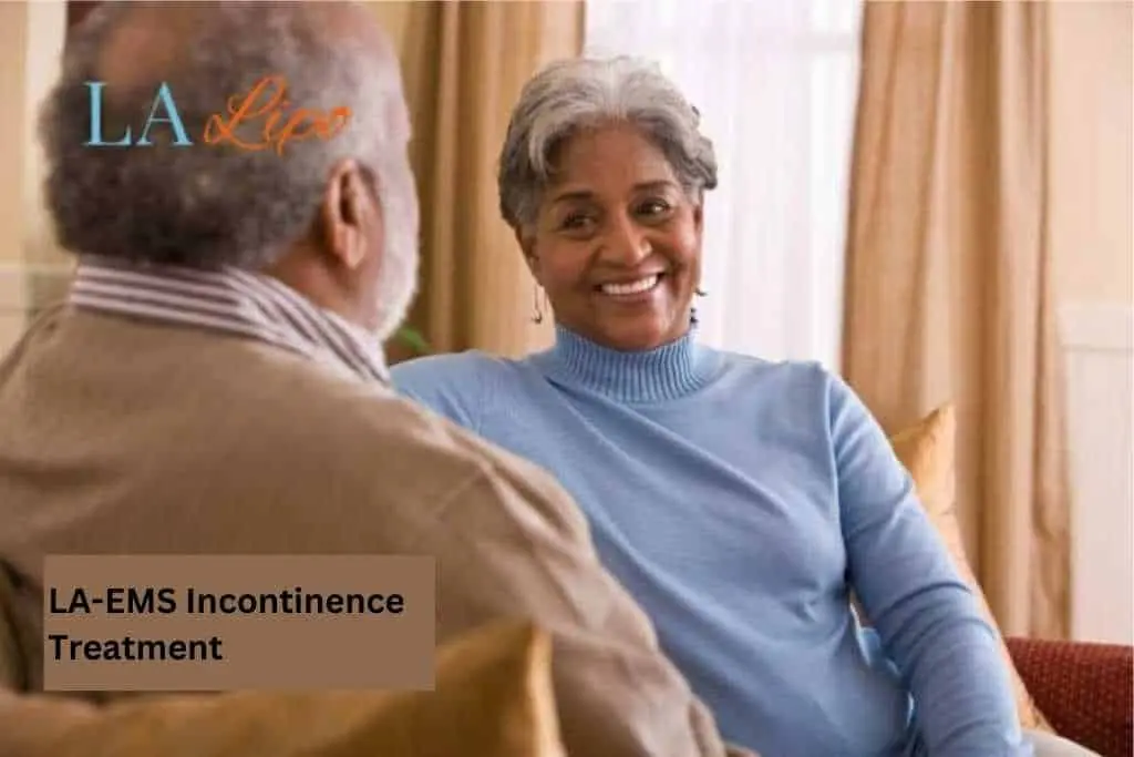 Couple sat smiling at each other - LA-EMS treatment Manchester